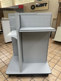 Metal 4-Way Peg PG retail display stand with peg hooks for hanging merchandise, designed for space-efficient product presentation.