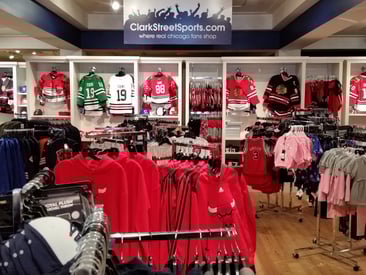 Store displaying 4-way racks, and wall mounts for jerseys