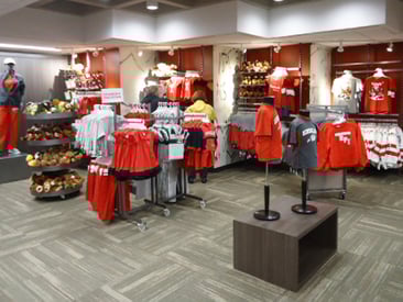 Store displaying mannequins, and clothes racks
