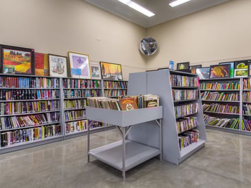 Showing vinyl record display along with book, dvd, and other media displays