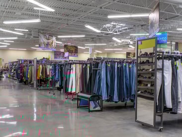 Showing aisles of sturdy denim pant racks