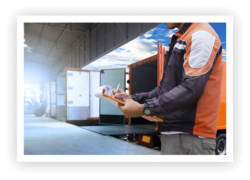 Logistics - Man looking at clipboard and Containers in the background