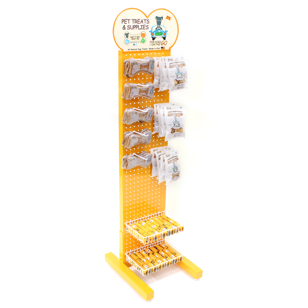 Yellow pet treat display stand with hooks for packaged treats and baskets for supplies. "Pet Treats & Supplies" sign with dog graphic.